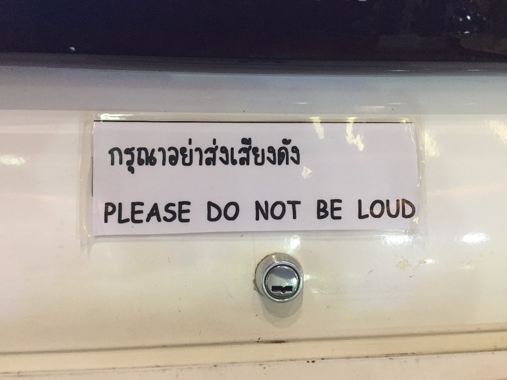 I think the Thai translation is incorrect. It says, "Please remove the muffler on your scooter." [Boisterous Bangkok]