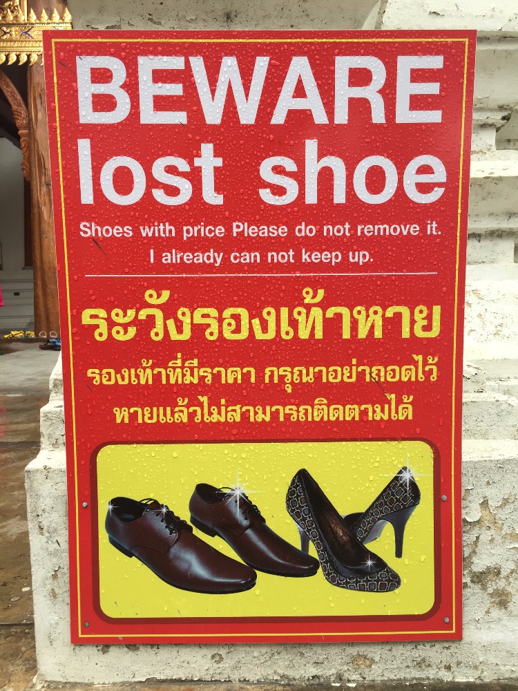 There is just so much going on here, I can't keep up with the sign. Should we put a price tag on our shoes? What if we don't have it? Did he lose his shoe or is he warning us about our potentially lost shoe? Does the thief just take one? The high heels are usually what my wife wears while traveling, but this time she went with flip flops, so we're probably OK. This time. 